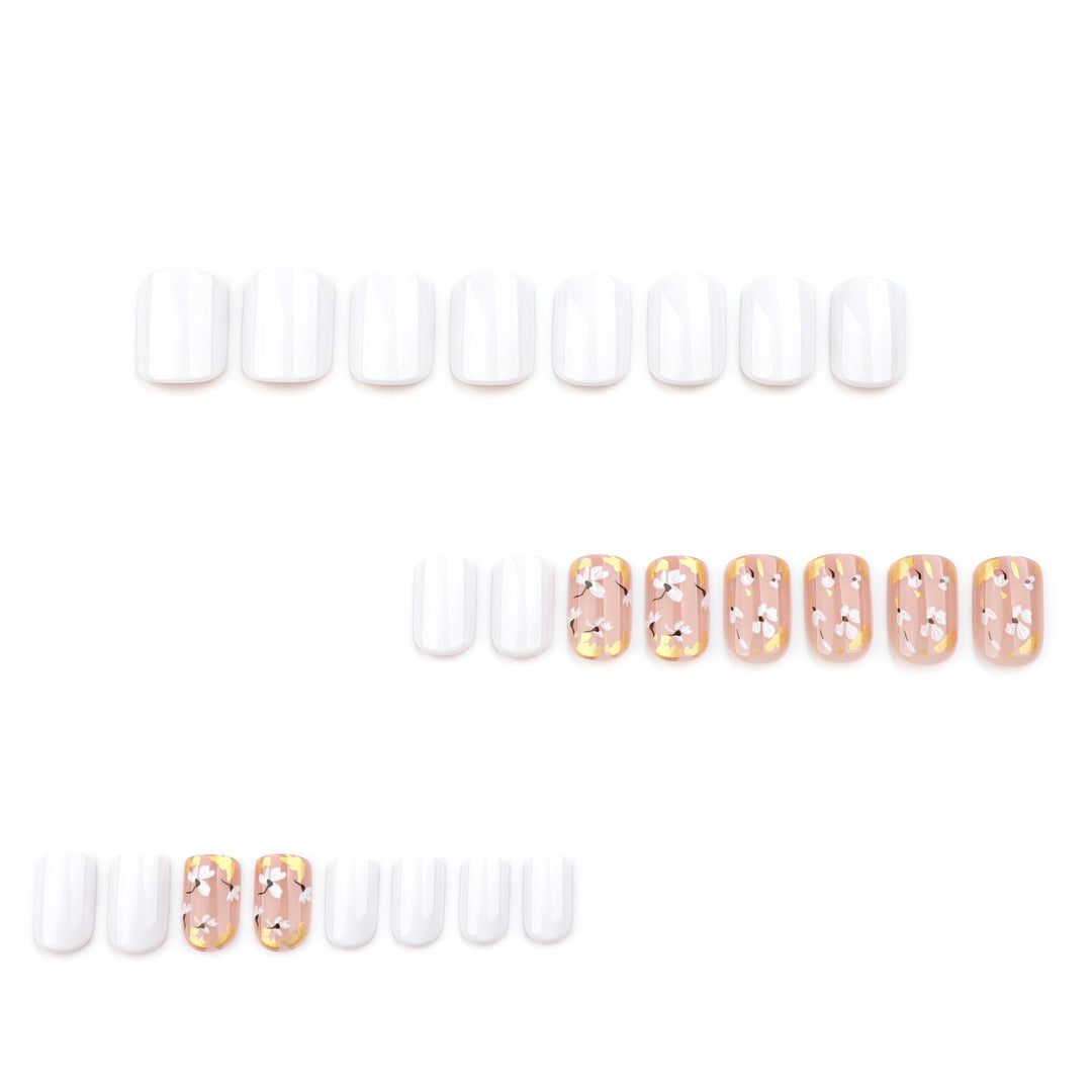 Artificial nail art with delicate flowers and glitter accents Bowlift