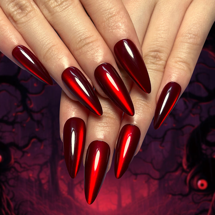 Creative Stiletto Nail Art with Blood Red Accents Bowlift