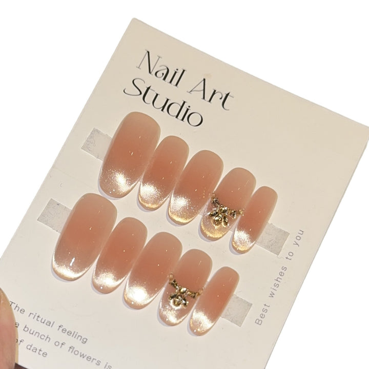 Artificial nails with elegant tip design and gold accents Bowlift