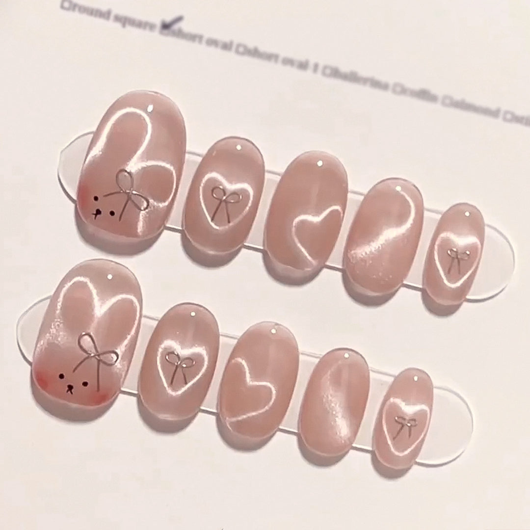 Artificial nail extensions with cute bunny design and hearts Bowlift