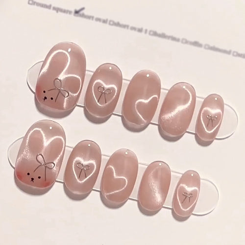 Artificial nail extensions with cute bunny design and hearts Bowlift