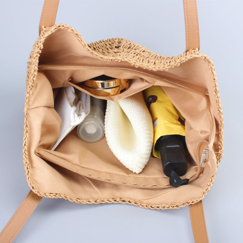 Casual bag made of handwoven straw with wide leather handles Bowlift