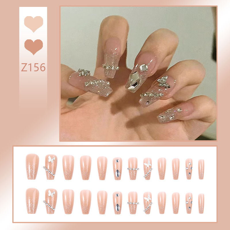 Glamorous artificial nails with sparkling rhinestones and elegant designs Bowlift