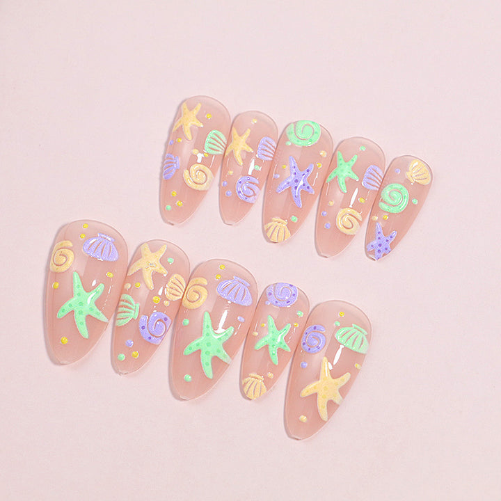Artistic Press-On Nail Design with Ocean-Inspired Accents Bowlift