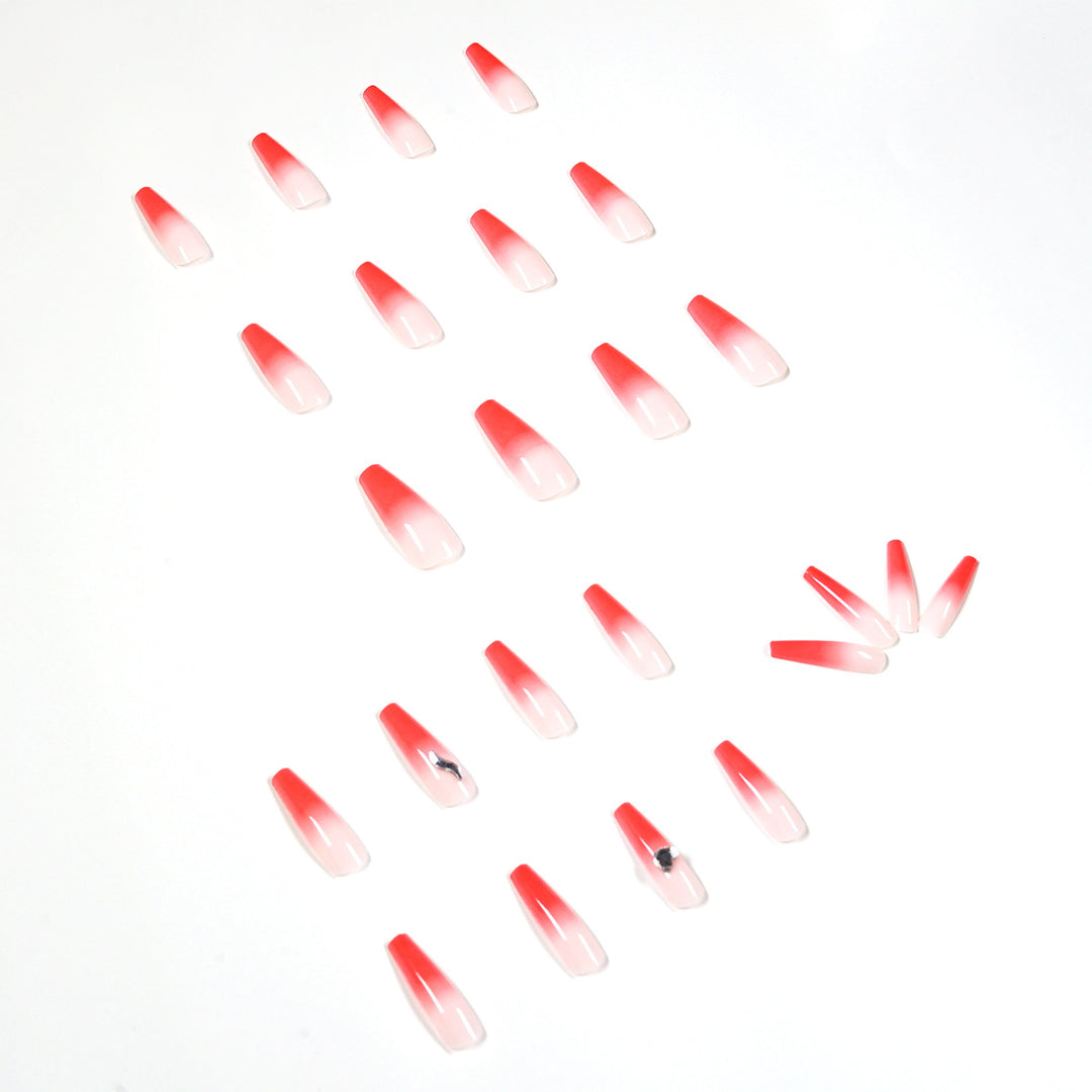 Artful stiletto nails with elegant gradient and rhinestone embellishment Bowlift