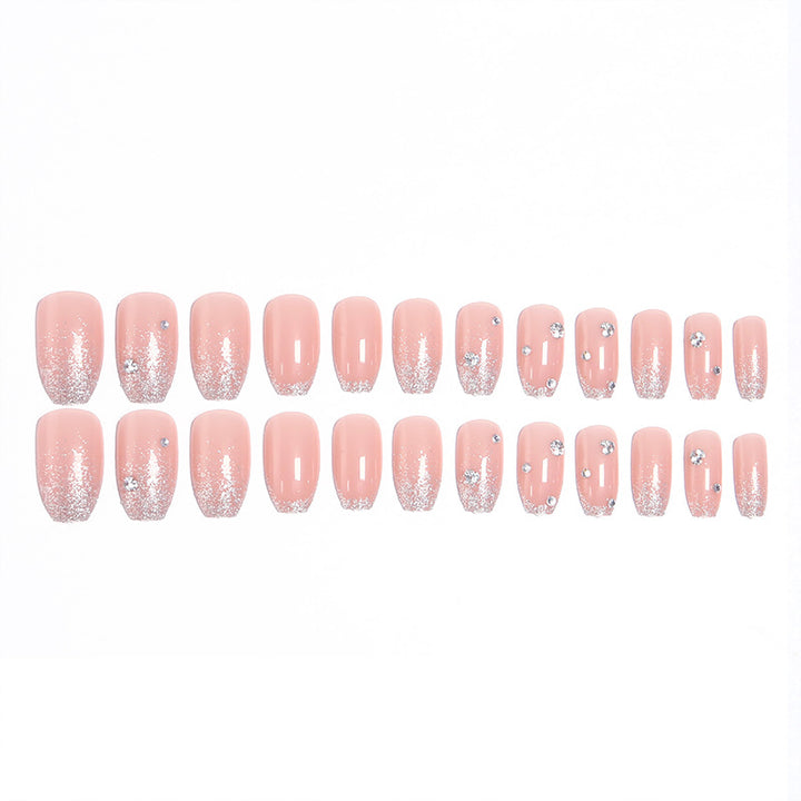 Glamorous artificial nails with glitter and rhinestone embellishments Bowlift