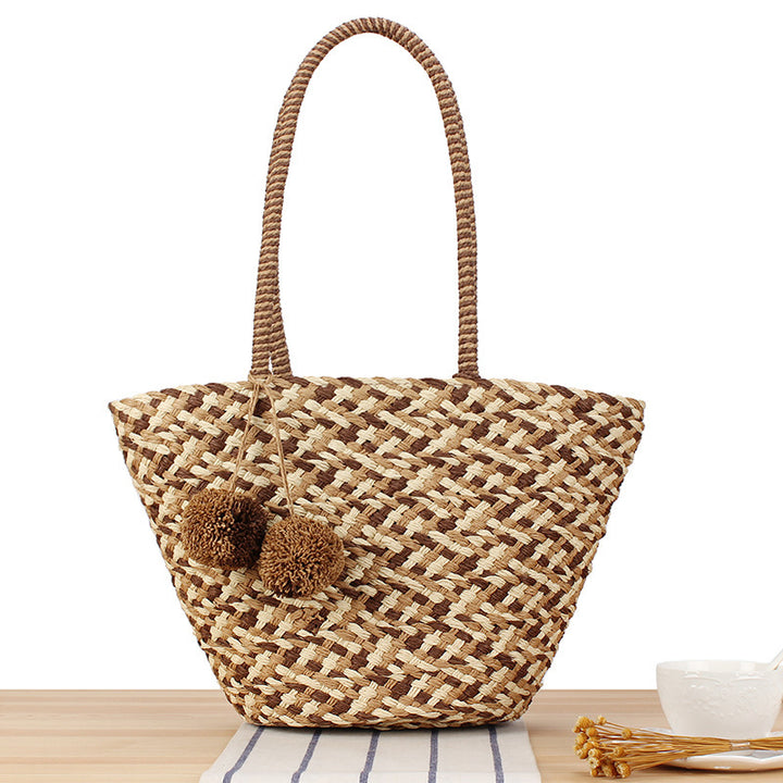 Fashionable basket bag with decorative pompons Bowlift