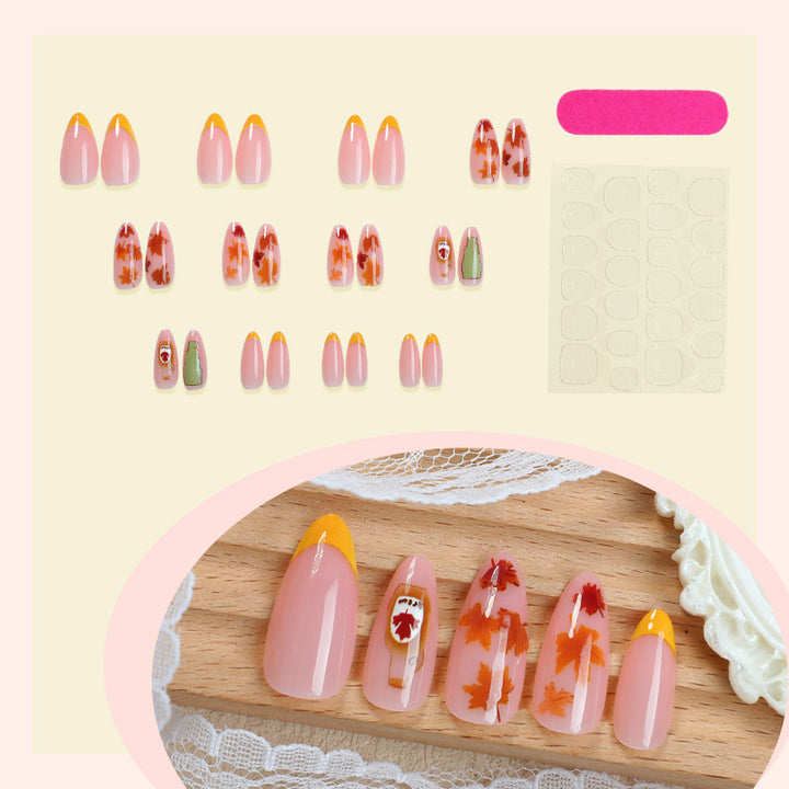 Artificial nail set with autumn leaf decorations and elegant color gradients Bowlift