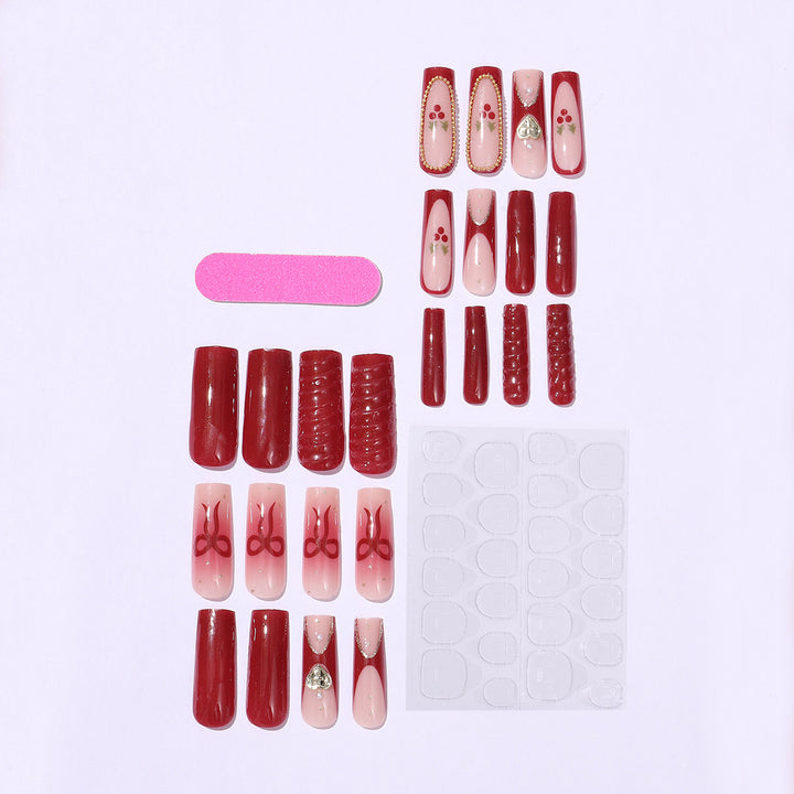 Artificial nail set with festive accents and glitter embellishments Bowlift