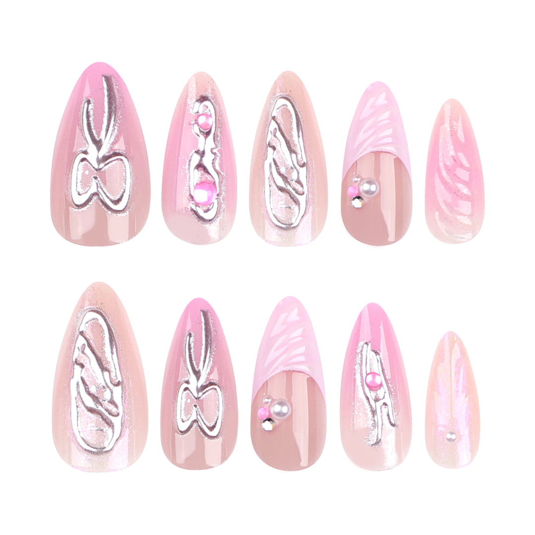 Artful stiletto nails with glitter and pearl decorations Bowlift