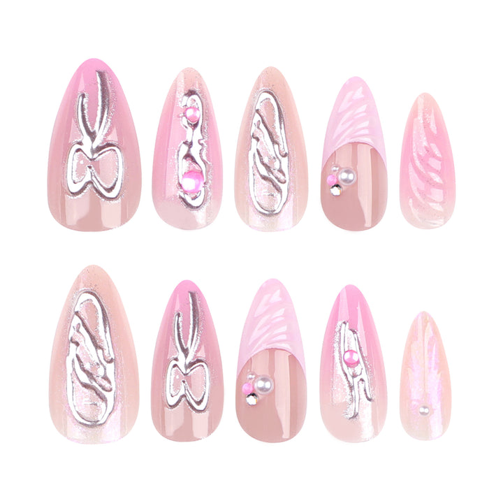 Artful stiletto nails with glitter and pearl decorations Bowlift