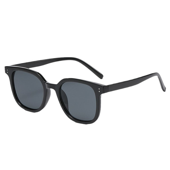 Women striking retro sunglasses with yellow-tinted lenses Bowlift