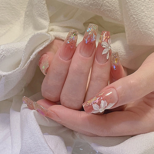 Artificial nail set with floral and glittering accents Bowlift