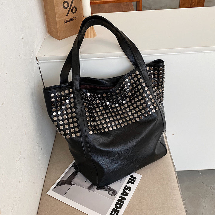 Fashionable shoulder bag with stylish rivet details Bowlift