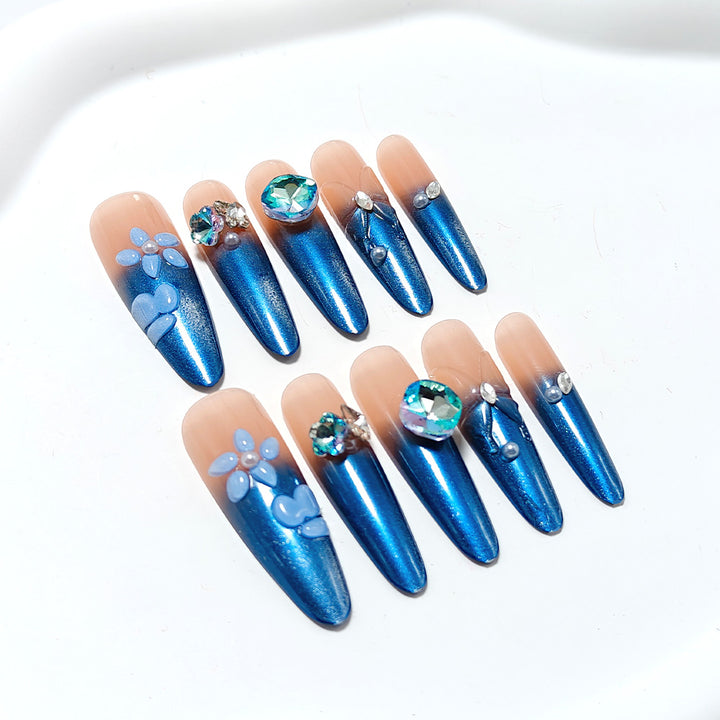 Artificial nails in elegant design with artistic decorations and glitter accents Bowlift