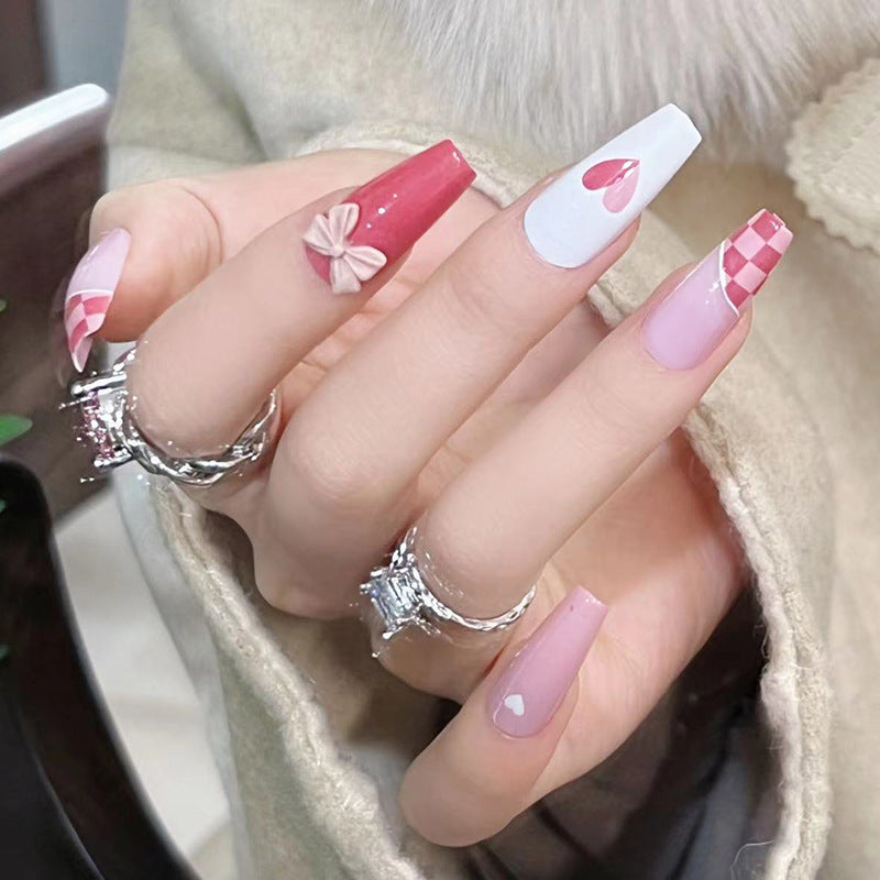 Artful nail extensions with playful designs and romantic accents Bowlift
