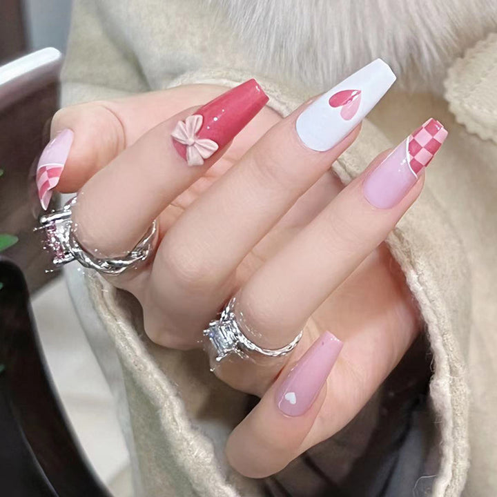 Artful nail extensions with playful designs and romantic accents Bowlift