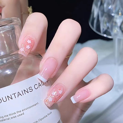 Nail art set with floral decorations and elegant French design Bowlift