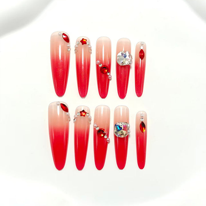 Artificial nails in elegant ombre style with glitter and jewelry accents Bowlift