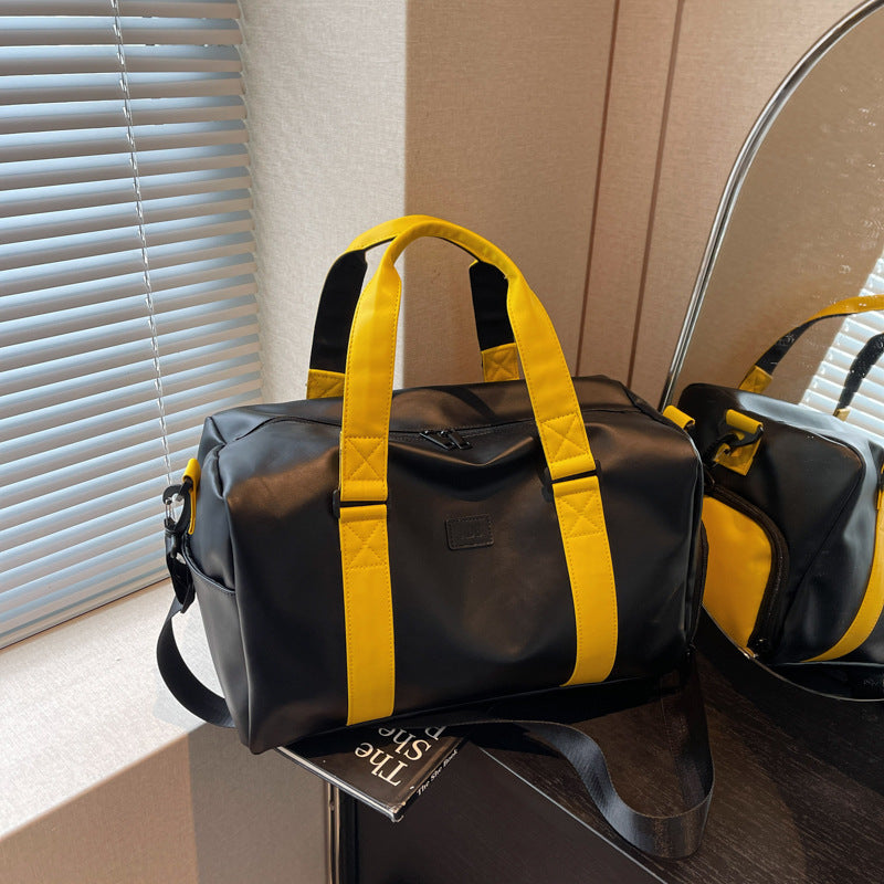 Sporty duffel bag with durable water-repellent material and versatile carrying options Bowlift