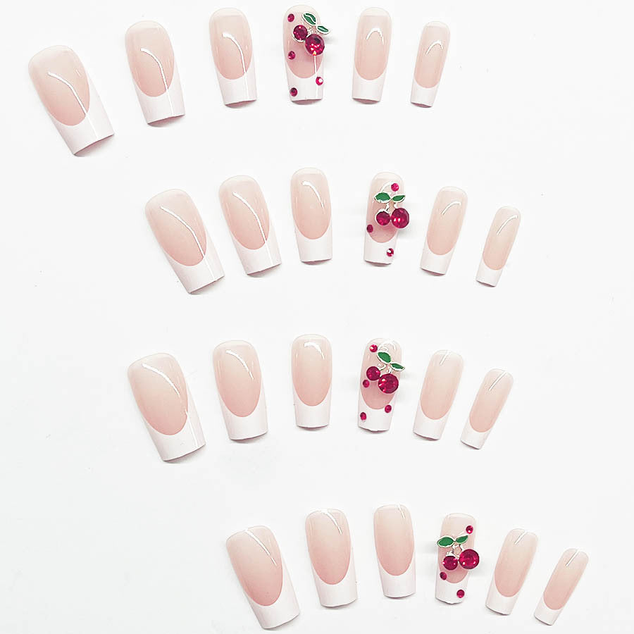 Acrylic nail set with chic cherry motifs and elegant French tip Bowlift