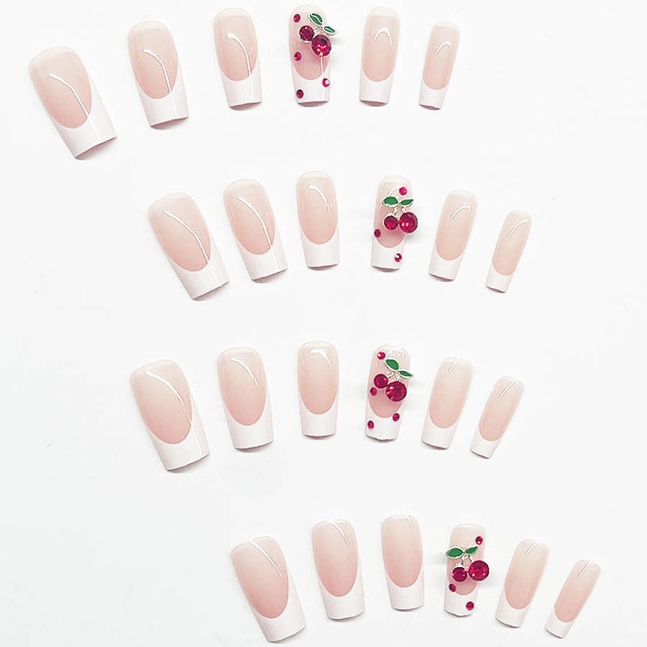 Acrylic nail set with chic cherry motifs and elegant French tip Bowlift