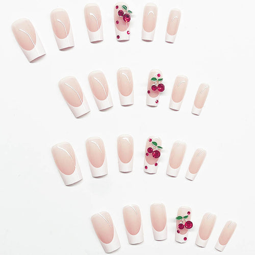 Acrylic nail set with chic cherry motifs and elegant French tip Bowlift