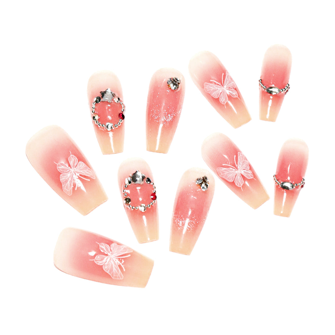 Artificial nail extensions with floral design and sparkling accents Bowlift