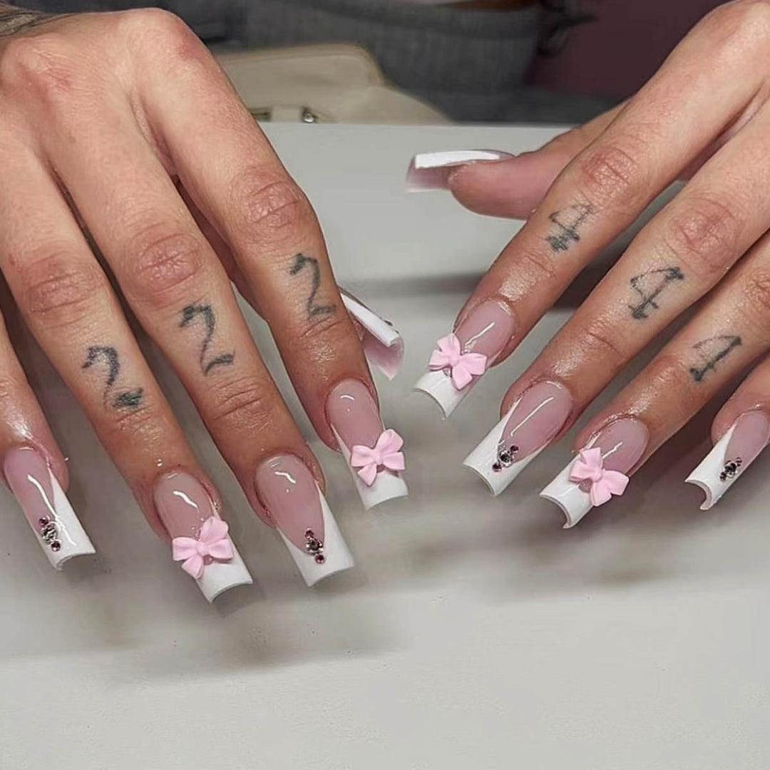 Trendy French-design artificial nails with bow accents Bowlift