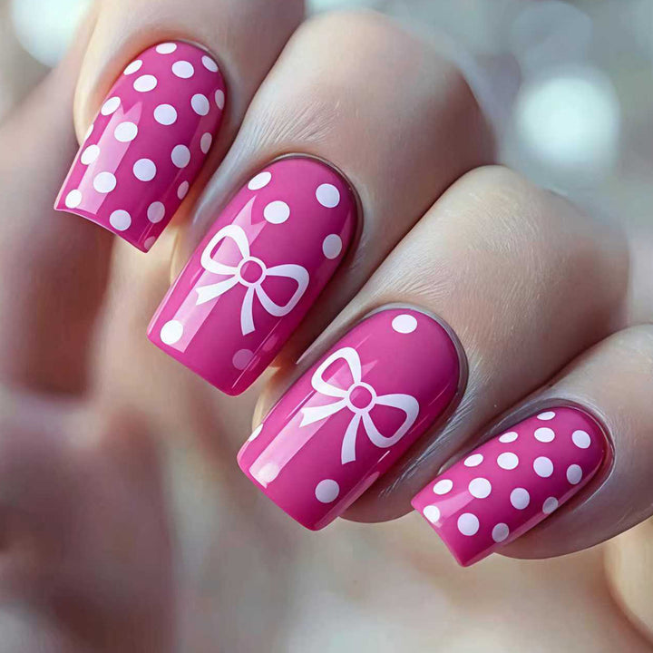 Artificial nails with romantic polka dot pattern and bow Bowlift