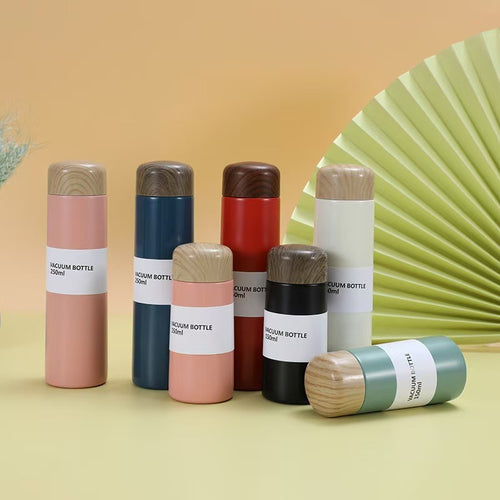 Women vacuum-insulated water bottle with innovative wooden lid Bowlift