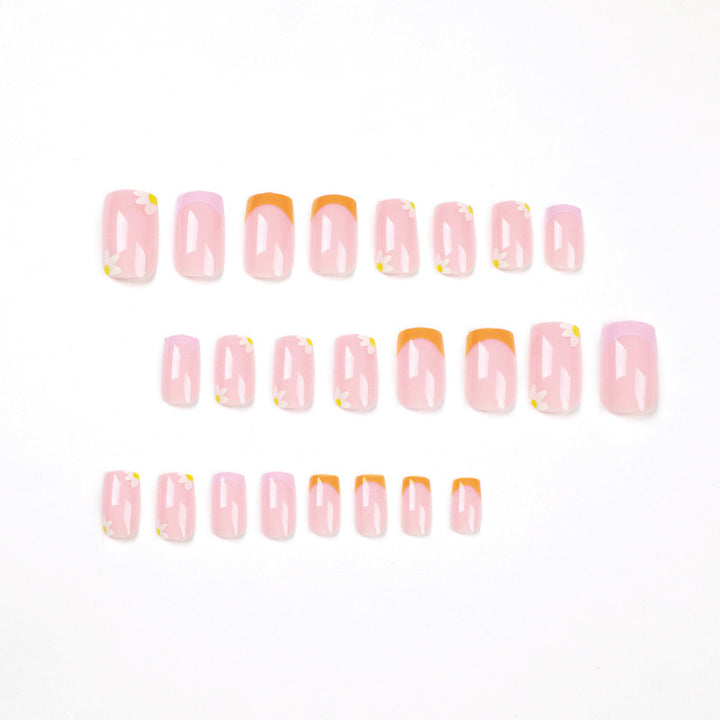 Artistic acrylic nails with floral design and creative color accents Bowlift