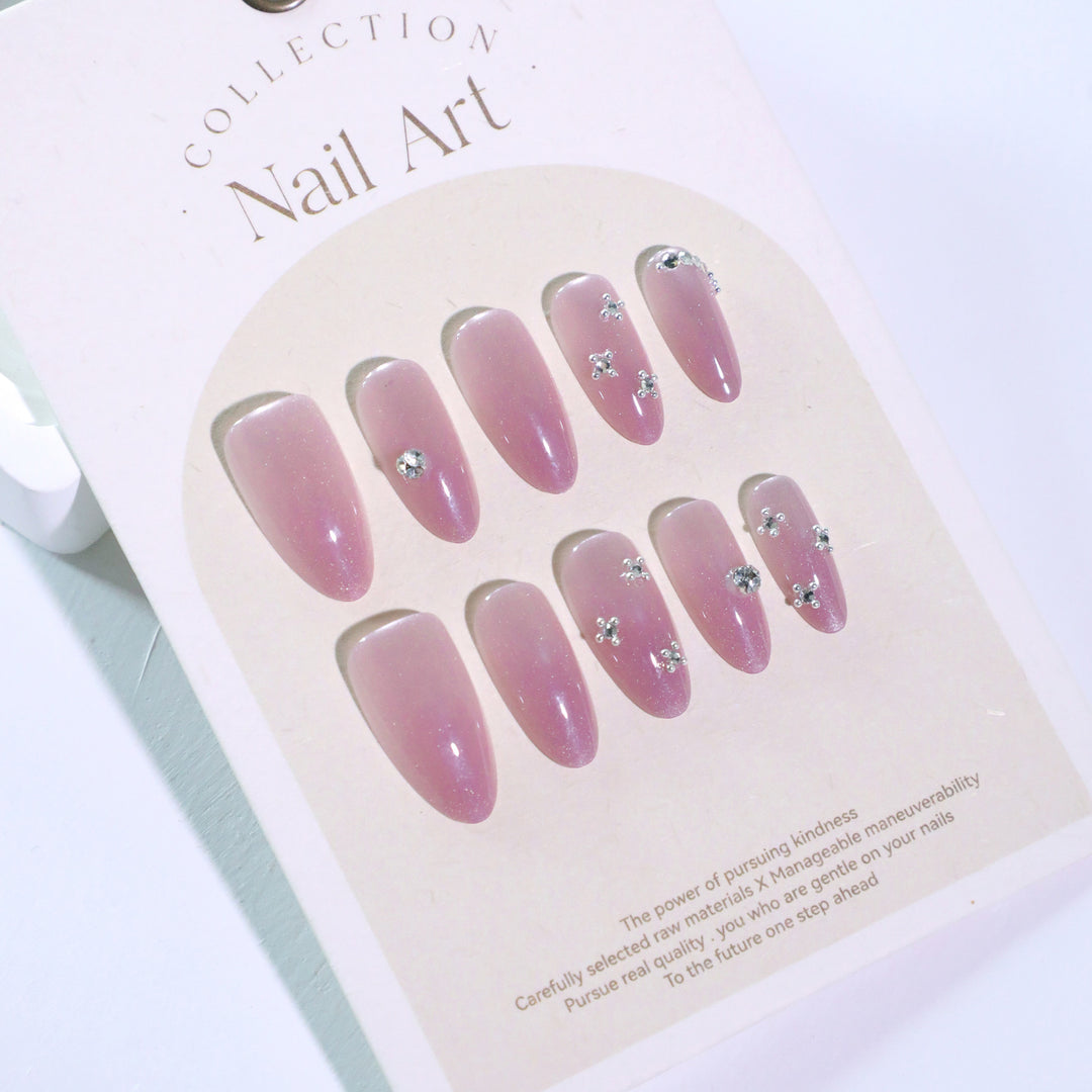 Artificial nail art with glitter embellishments Bowlift