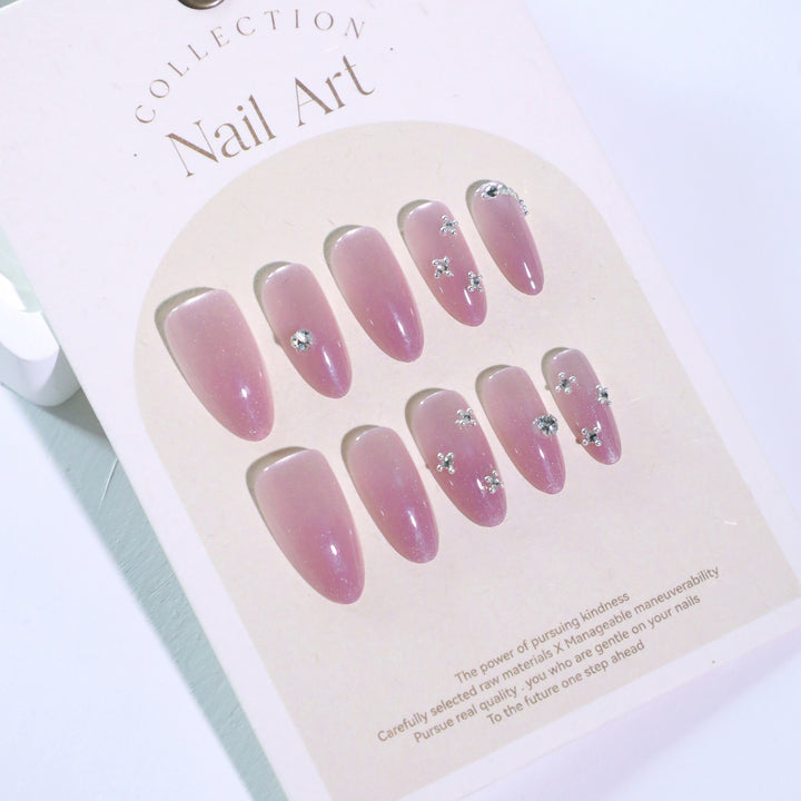 Artificial nail art with glitter embellishments Bowlift