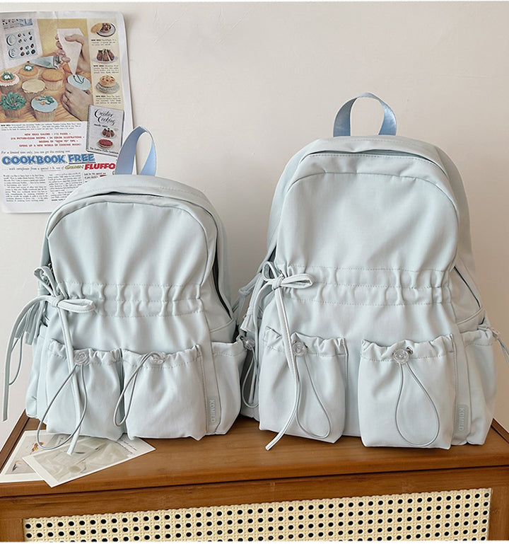 City backpack with innovative compartment system and adjustable carrying straps Bowlift