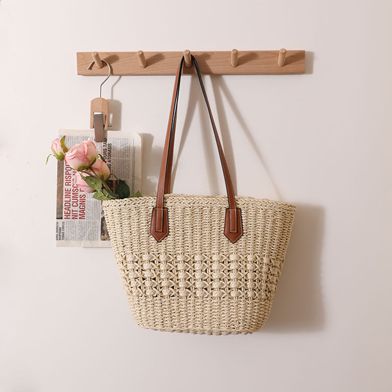 Handcrafted rattan basket bag with elegant leather accents Bowlift