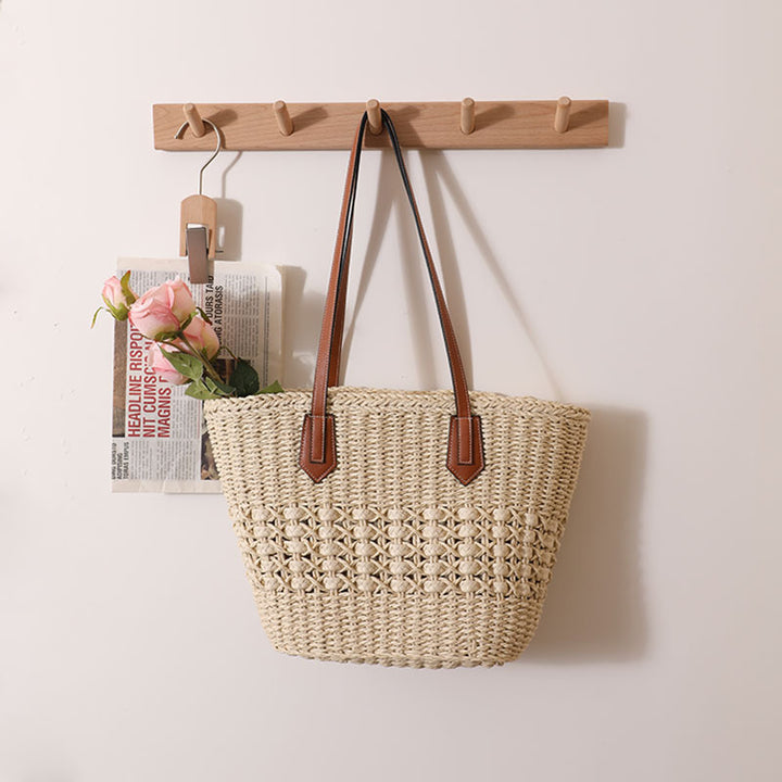 Handcrafted rattan basket bag with elegant leather accents Bowlift