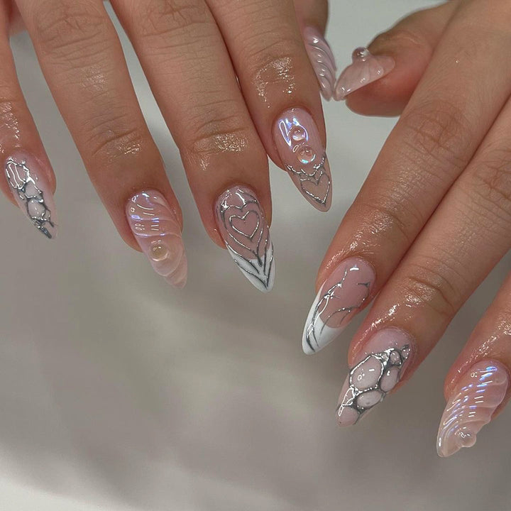 Elegant Stiletto Nail Extensions with Decorative Silver Accents Bowlift