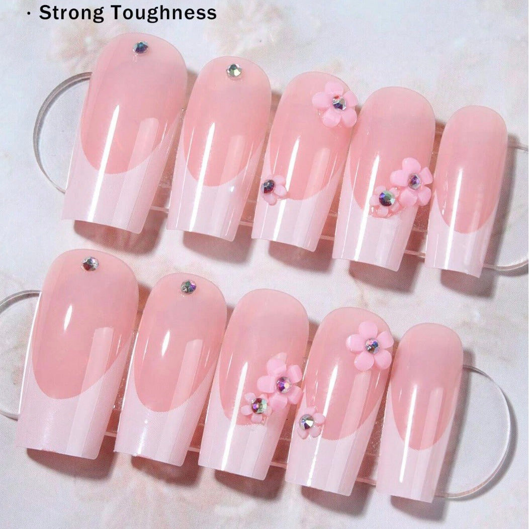 Artificial nail set with elegant 3D flowers and glamorous rhinestone accents Bowlift