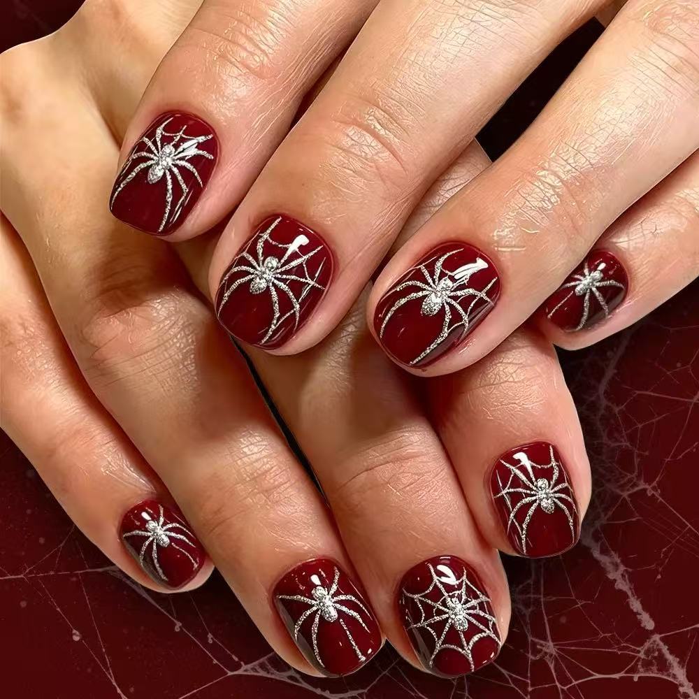 Acrylic nail set with spooky spider and glitter accents Bowlift