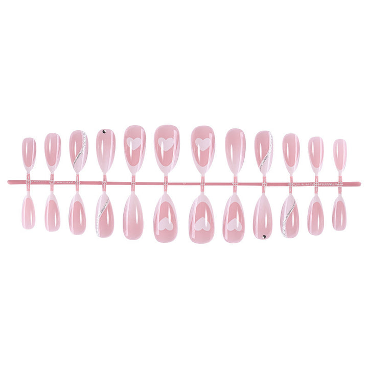 Acrylic nail set with romantic heart and glitter accents Bowlift