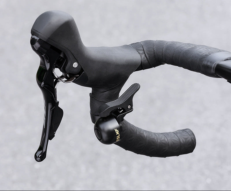 compact bicycle handlebar bell with quick release clamp and ergonomic thumb lever Bowlift
