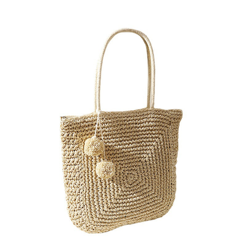 Handmade straw bag with pompom details Bowlift