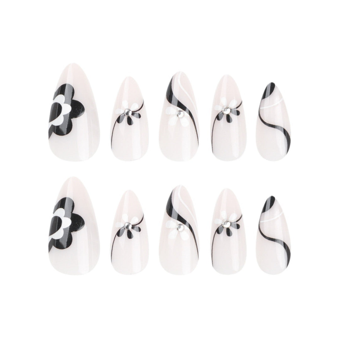 Artistic nail extensions with floral accents and glitter accents Bowlift