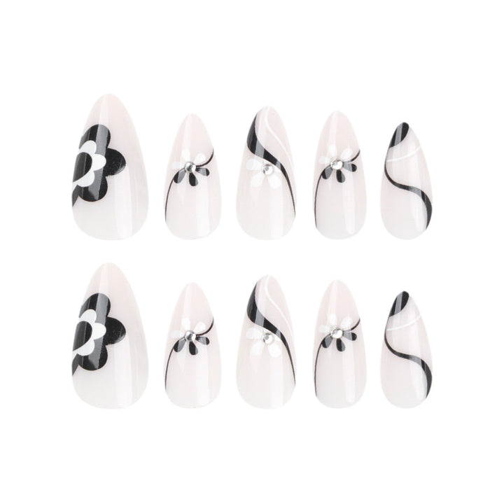 Artistic nail extensions with floral accents and glitter accents Bowlift
