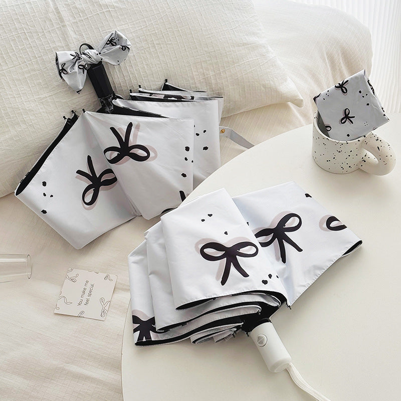Women’s Folding Umbrella with Playful Bow Pattern Bowlift