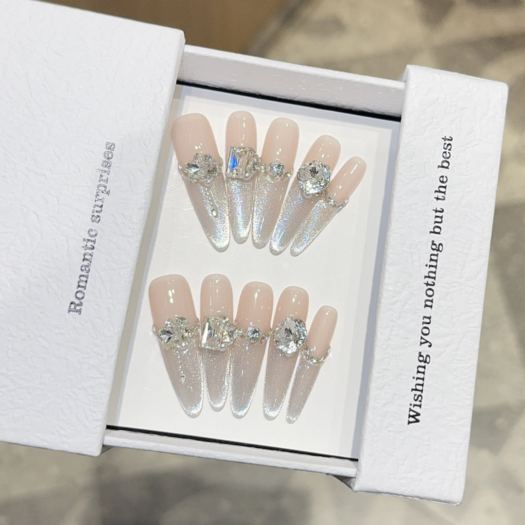 Glamorous artificial nails with sparkling rhinestone embellishments Bowlift