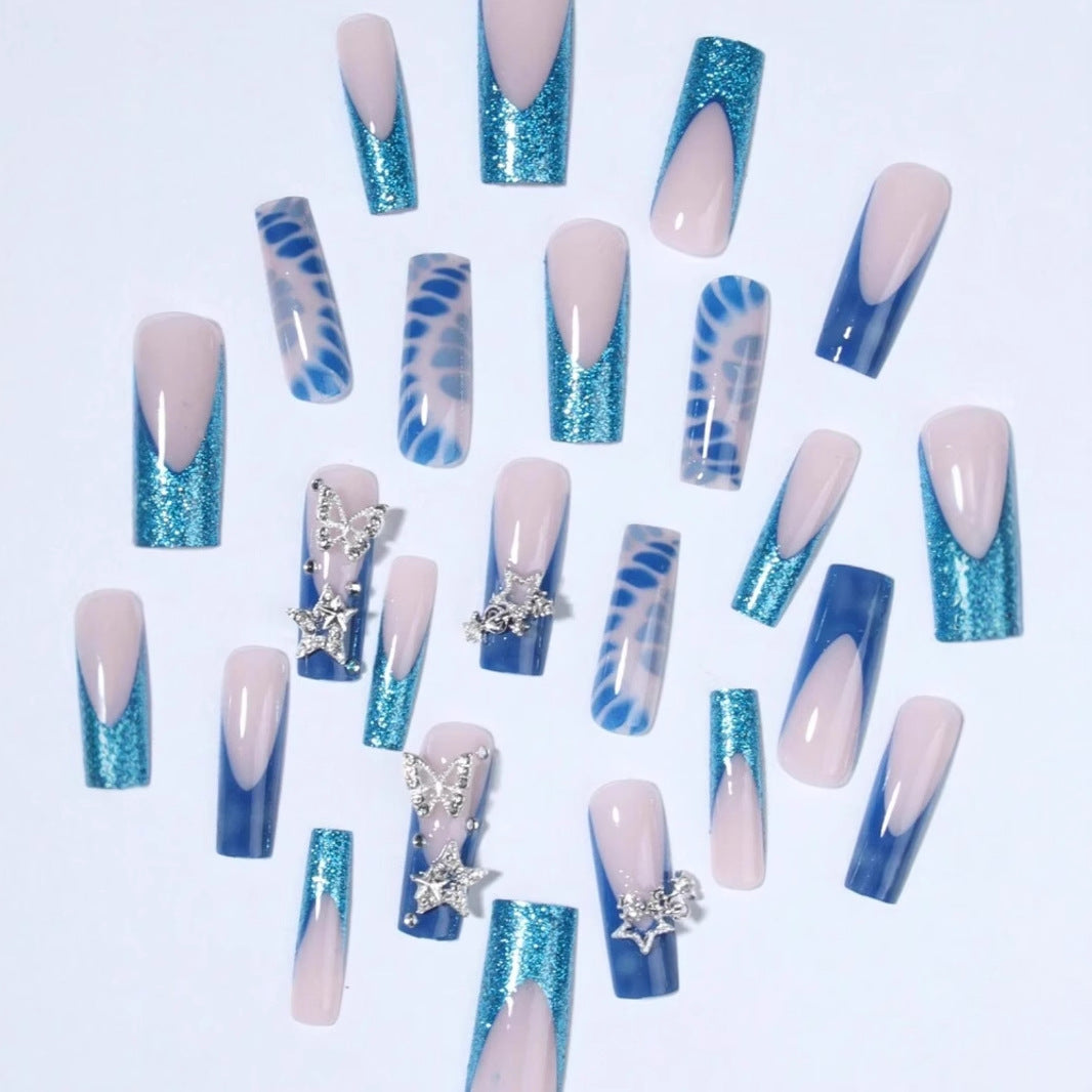Glamorous artificial nail tips with adorned stars and glitter Bowlift
