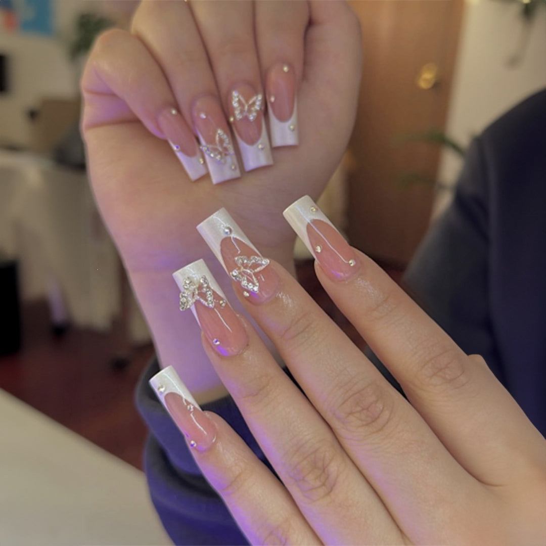 Artificial nail set with luxurious glitter and delicate floral designs Bowlift