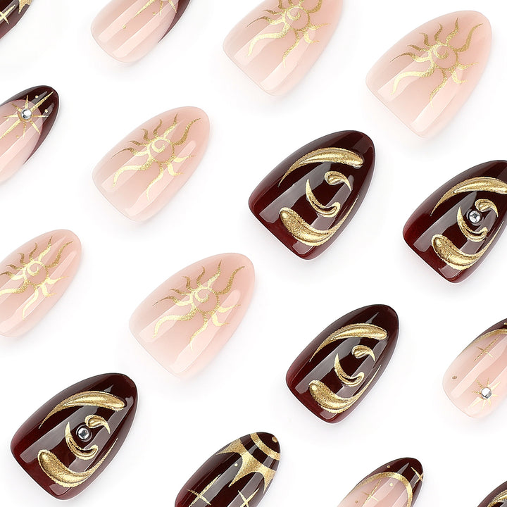Artful nail art with golden accents and mystical motifs Bowlift